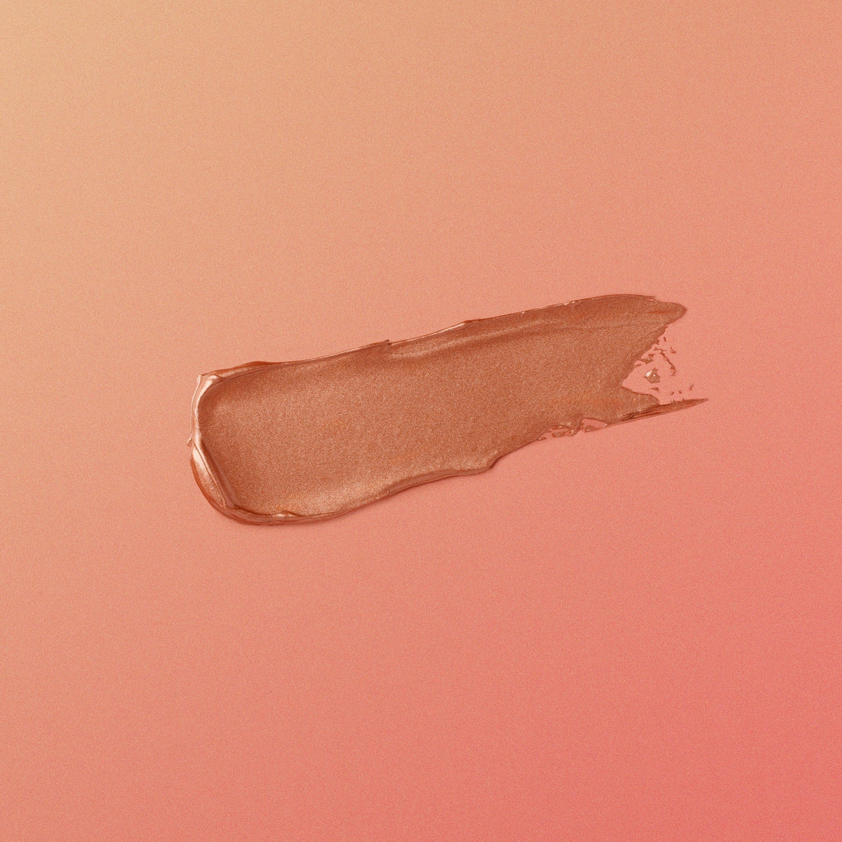 Nude-colored makeup swatch on a matching pink background