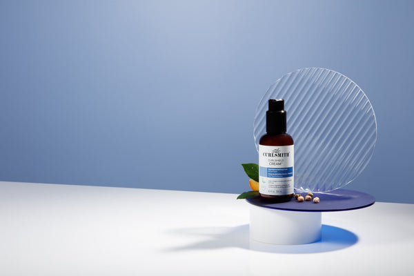 Curlsmith Curlshield product on a blue background