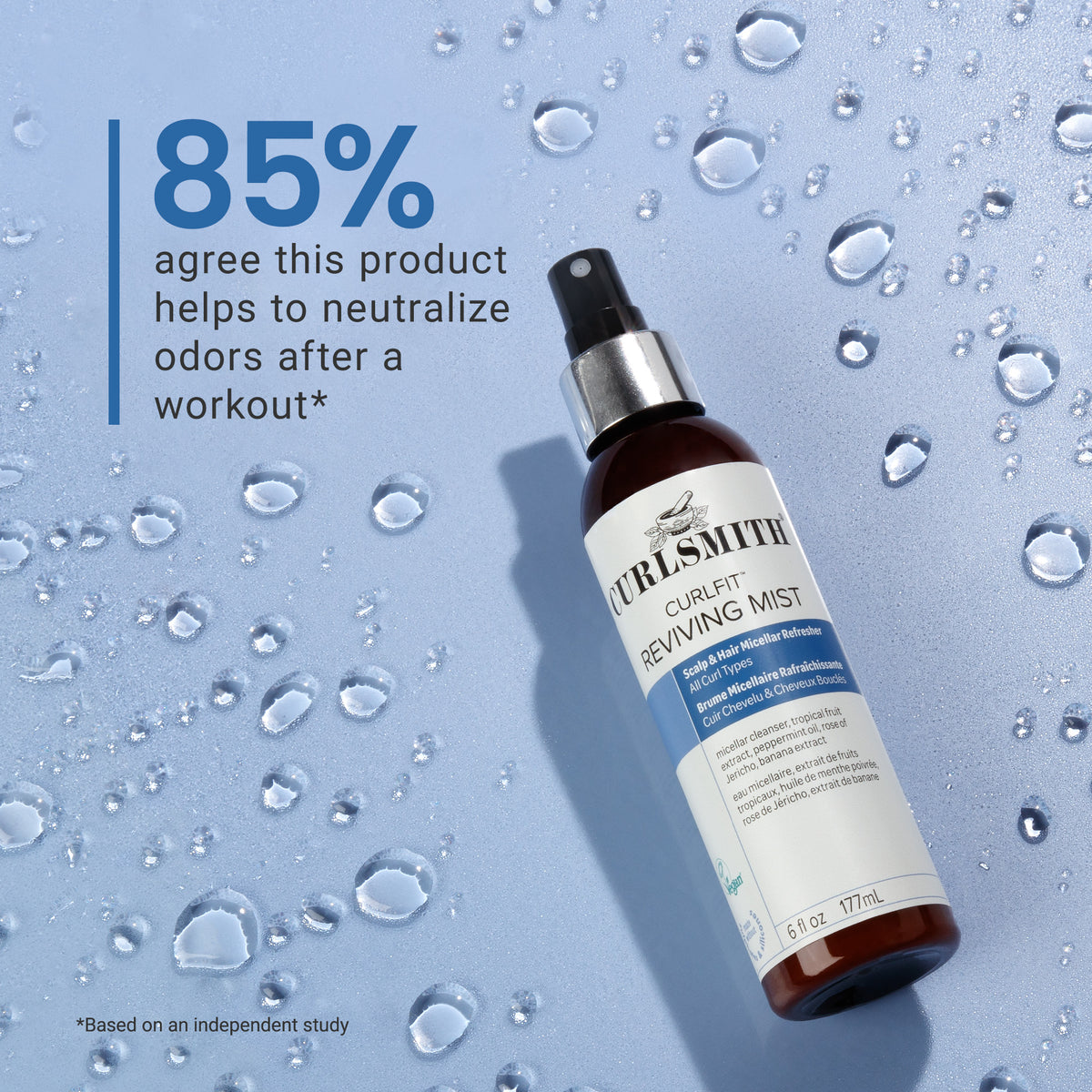 Bottle of Curlsmith Reviving Mist on a blue background with water droplets