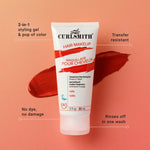 Curlsmith hair makeup tube on a peach background with product features highlighted.
