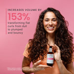 Woman holding a bottle of hair product with text on a pink background